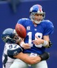 Giants quarterback Eli Manning is sacked by Patrick Kerney of the Seattle Seahawks at Giants' Stadium. (Photorapher: Scott Eklund)