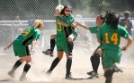 Blanchet's Adrianne Loyola jumps into the arms of pitcher Aly Schoonover following their victory over Bellevue in the 3A Sea-King District fastpitch playoffs. (Photographer: Scott Eklund)