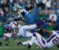 Seattle Sehawks full back Mack Strong is upended by Minnesota Vikings linebacker E.J. Henderson. (Photographer: Dan DeLong)