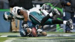 Seattle Seahawks wide receiver Keary Colbert is unable to hold onto a pass in the endzone as Philadelphia Eagles safety Brian Dawkins lands atop him. (Photographer: Dan DeLong)