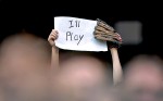 A young fan holds a sign protesting a potentential Major League Baseball strike during a Rockies game in Denver . (Photographer: Andy Rogers)