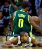 Washington's Joel Smith gets tangled up with Oregon's Aaron Brooks while going for a steal. (Photographer: Scott Eklund)